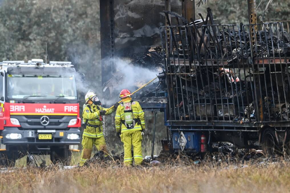 Firefighters attend a truck fire on the Davey Road exchange with the Hume Highway at Table Top. Picture by Mark Jesser