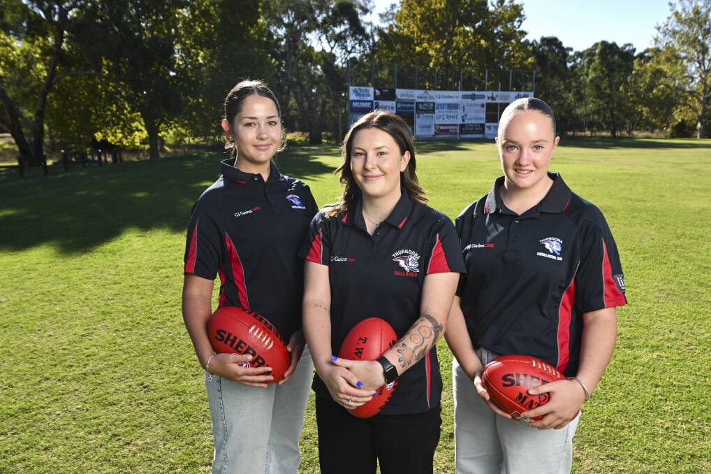 Thurgoona Female Football Club's Emily Simmons, 13, under-14 coach Tiara Willis and Ruby Hilton, 14, are enjoying the season together. Picture by Mark Jesser.