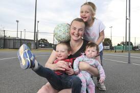 Dederang Mt Beauty A-grade netball captain Alysha de Koeyer with her kids Louie, 3, Molly-Rose, four months and Maisie, 4. Picture by Mark Jesser