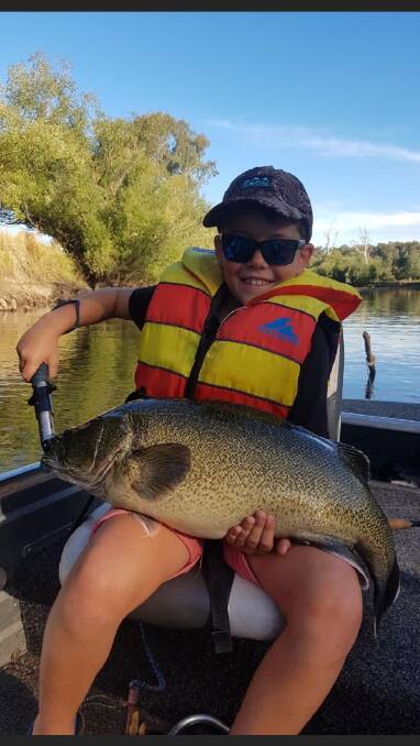 WOW: Corryong's Callum Mulquiney, 8, shows off an 82-centimetre cod he caught in the Murray on a spinnerbait. Share your pictures by sending them to 0475 947 279.
