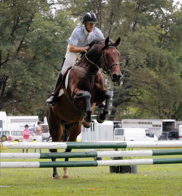 AIMING HIGH: Tony Erickson, of Jingellic, competes in the 70cm showjumping class at last year's Jingellic Show. The event will not take place next month. 
