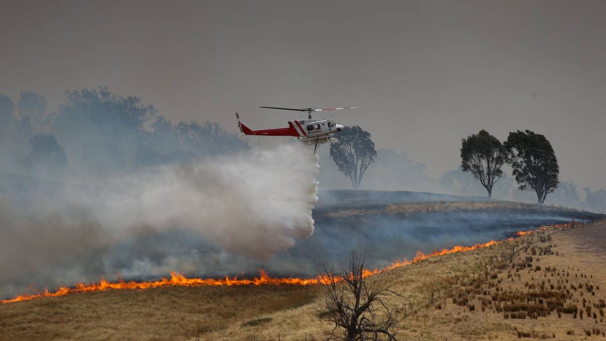Water-carrying aircraft tackle the fire in the Indigo Valley. Picture: MARK JESSER