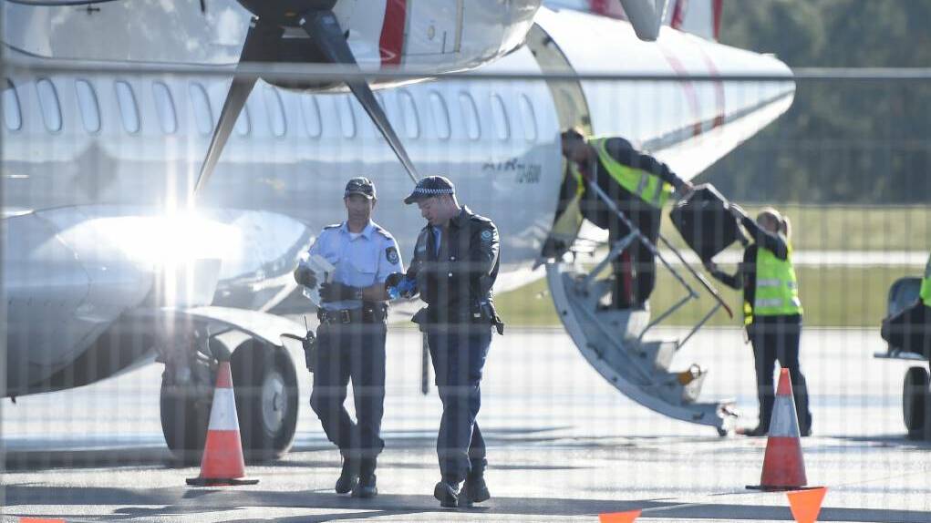 The Virgin flight from Sydney to Albury was evacuated immediately after landing about 9.30am. Pictures: MARK JESSER