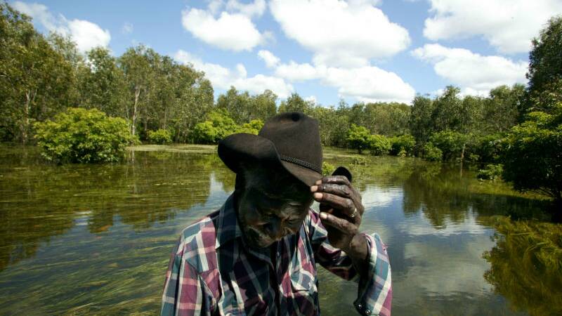 Proud local Jacob Nayinggul on a flooded Magili Creek, in a moment of camera-shyness. 