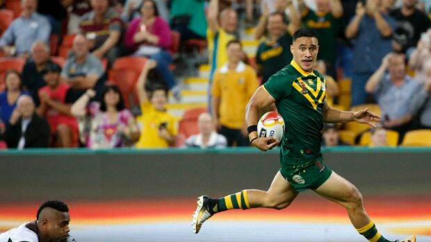 Holmes sweet Holmes: The Kangaroos winger crosses for one of his six tries against Fiji on Friday night. 