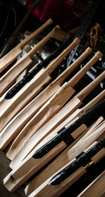 THE PROCESS: A range of Zac's completed and in progress bats at his home in Glenroy, where he manually creates each one.