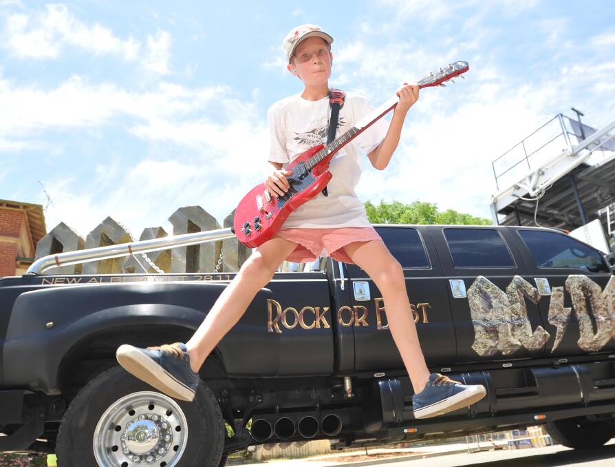 GUITAR SHRED: Jack Best, 11, pulls his best rockstar jump for the camera at the 2014 Rock or Bust music festival. Ten bands will vie for recording time with Sony music and $2000 cash. 