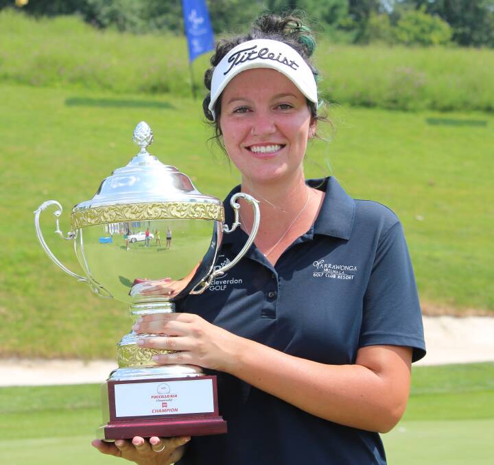 GREEN WITH ENVY: Yarrawonga's Bree Elliott, with her green hair and the trophy for her maiden professional victory at the Fuccillo Kia Championship at Capital Hills in New York. Picture: Courtesy of ALPG