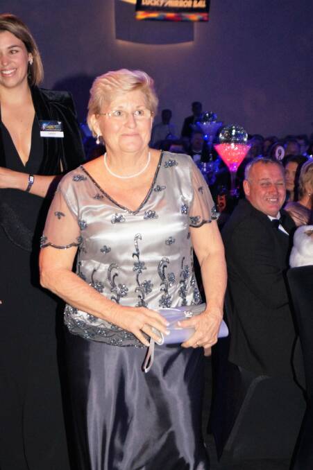 Lesley De Landelles receiving her award at the RFDS Wings for Life gala ball in Brisbane last year. Photo supplied.