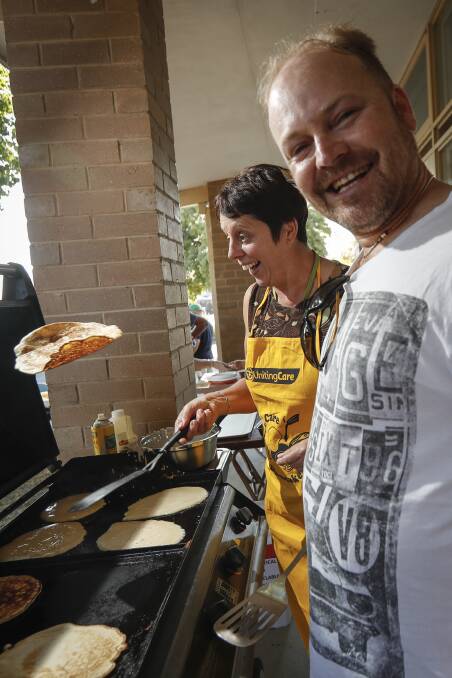 FULL TOSS: UnitingCare Wodonga emergency relief coordinator Catherine Byrne and cook Brett Ashlin have all the right moves for Shrove Tuesday. Pictures: JAMES WILTSHIRE