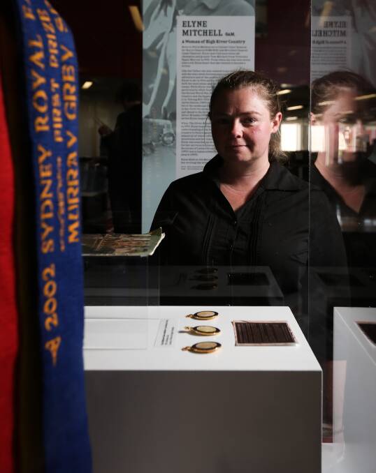 FRESH PERSPECTIVE: Albury Library Museum curator Emma Williams looks at The Women of the River Country exhibition, open until December 4. Picture: JAMES WILTSHIRE