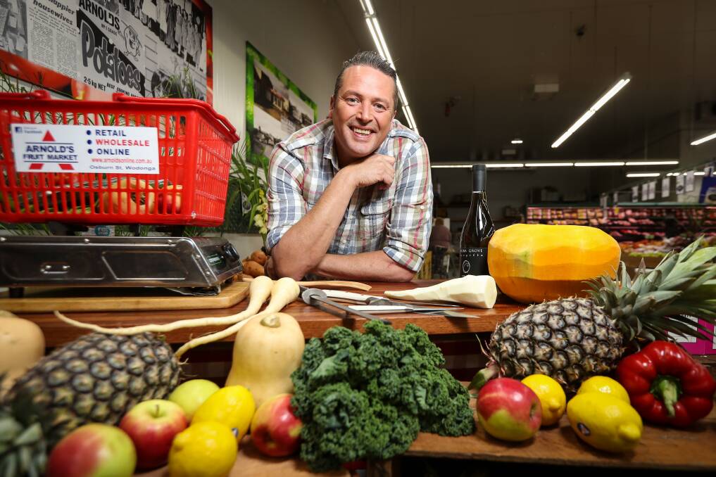 FRESH APPROACH: Celebrity chef James Reeson selects produce from Arnold's Fruit Market to film Alive and Cooking in Wodonga on Thursday. Pictures: JAMES WILTSHIRE