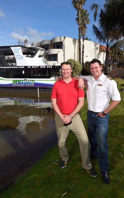 SMOOTH SAILING: Fraser and Robbie Knowles will set a course for Albury in their modern vessel The Sienna Daisy as soon as river levels allow. Pictures: MARK JESSER
