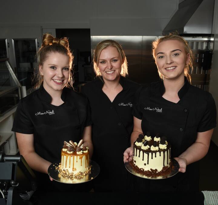 CREATIVE TEAM: Miss Naked Cakes trainee Abbey Groth, owner/operator Clare Doolan and part-time employee Morgan Lewis display the decadent Twix and Oreo cakes in the Wodonga bakery. Pictures: MARK JESSER