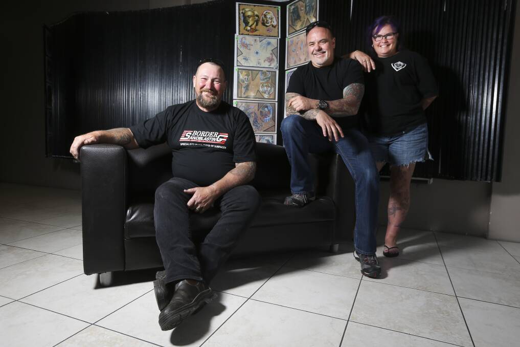 Craig Nolan with Twin City Tattoo and Body Piercing owner Brett Collins and Craig's wife Lisette Nolan. Picture: ELENOR TEDENBORG
