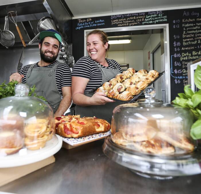 STREET CRED: Pinchos Catering, Andiamo Street Food and Pop Up Supper Clubs co-owners Andrea Burgio and Farrah Reid with freshly-made street food baked in their Wodonga shopfront. Pictures: JAMES WILTSHIRE