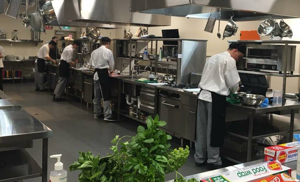 TEAM WORK: The secondary college students compete in the Murray River Culinary Challenge grand final at St Mary MacKillop College at Swan Hill on Monday.