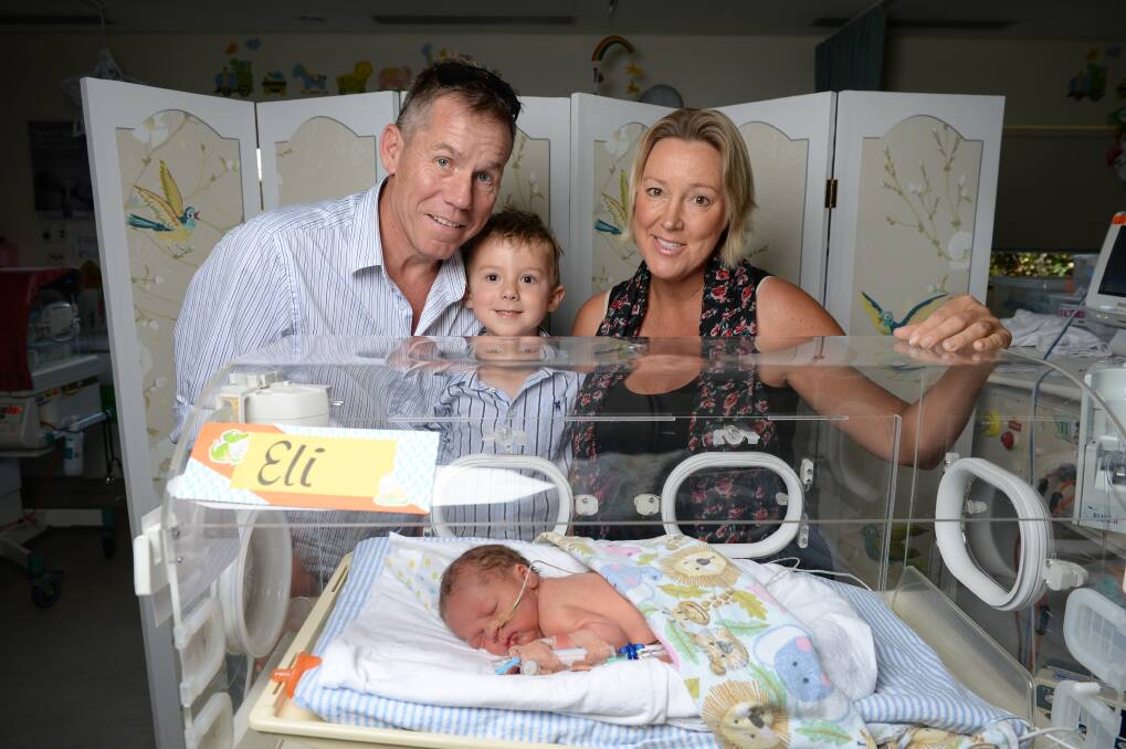 ELI MAKES FOUR: Elenor Tedenborg, her partner Simon Bayliss and their son Charlie, 3, welcome Eli to the world ahead of schedule in Wodonga. Elenor will soon start treatment for breast cancer. Picture: MARK JESSER