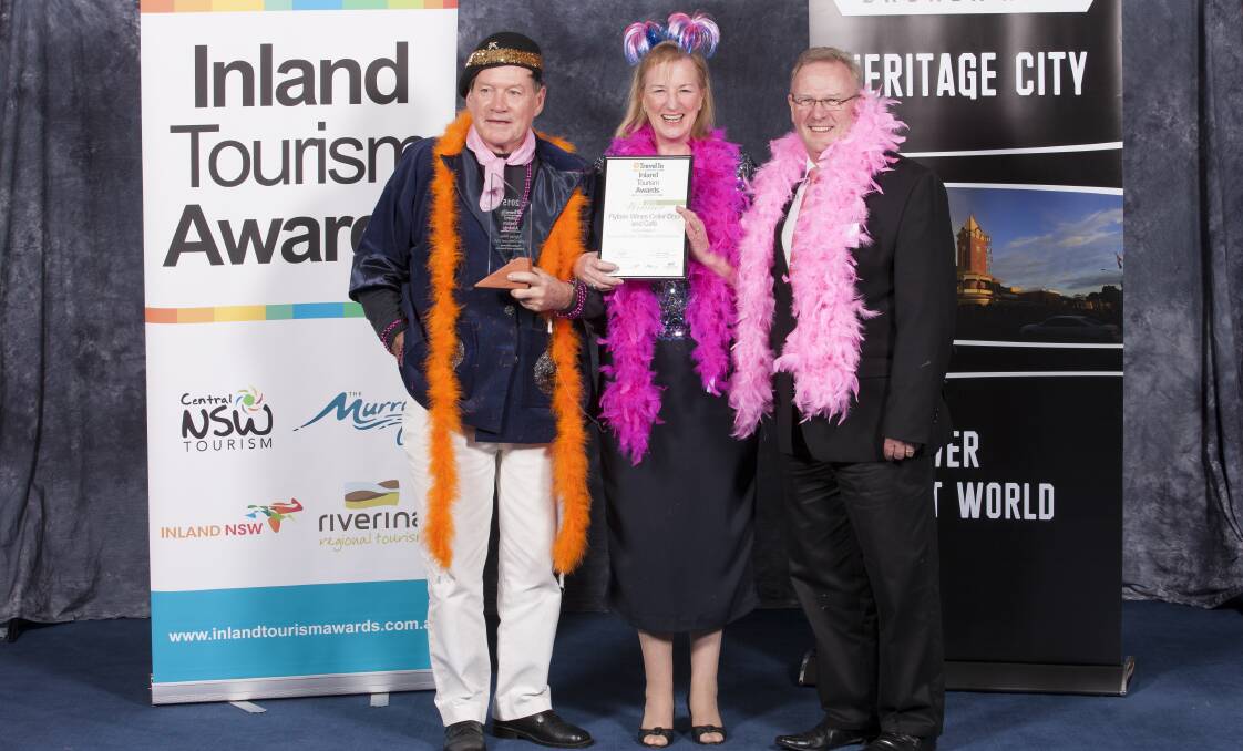 TOURIST ATTRACTION: Flyfaire Wines' Les Hanel and Julianne Cox with Inland NSW Tourism chairman Rodger Powell. Picture: LOOSE CANON IMAGES