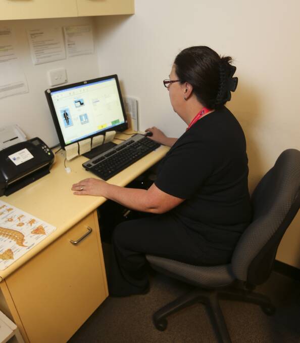 BONE DATA: West Albury service Regional Imaging radiographer Sue Gibbins analyses bone density data ahead of World Osteoporosis Day. Pictures: ELENOR TEDENBORG