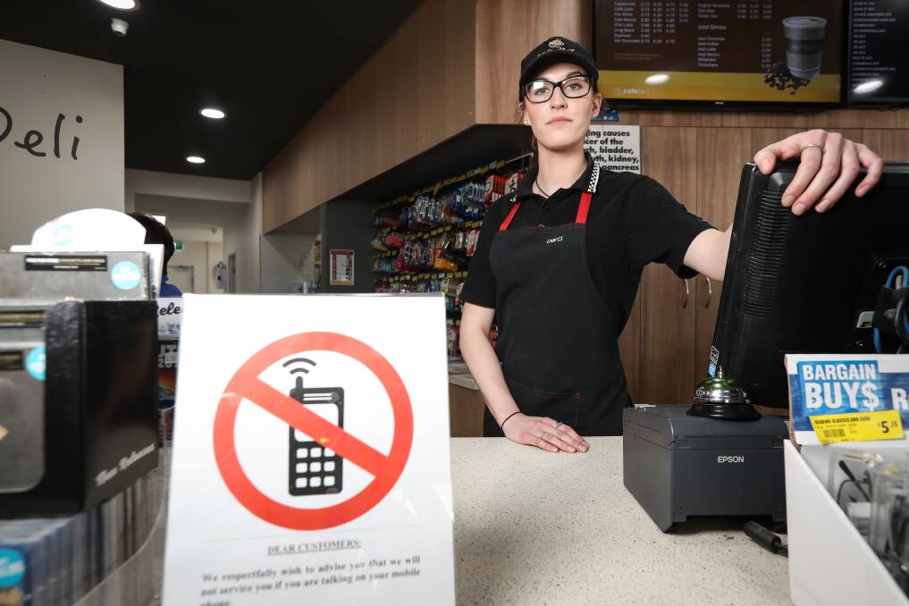 APCO Wodonga barista Darci D’Helin-Lawrie says when customers cannot get off their mobile phones long enough to be served in the store it shows a total lack of respect for the staff. Picture: JAMES WILTSHIRE