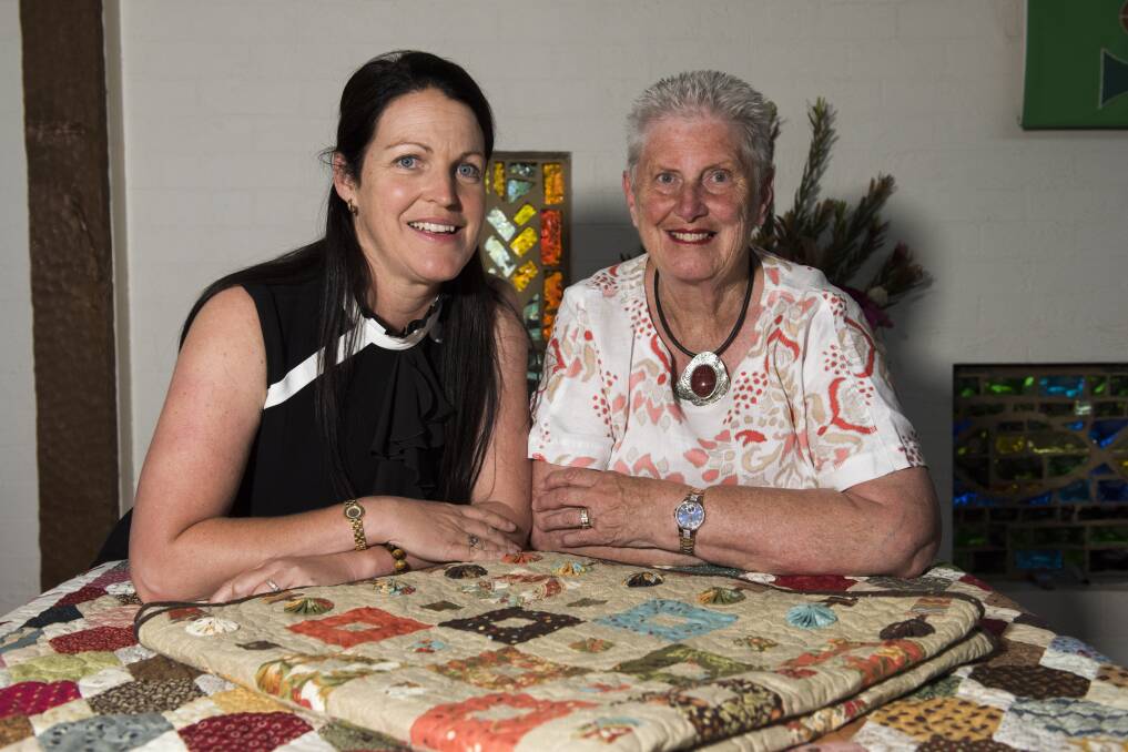CARE FACTOR: UnitingCare Wodonga agency manager Naomi Jansen with Maureen Jones, from Murray River Quilters, which has donated money to emergency care support services on the Border. Picture: SIMON BAYLISS
