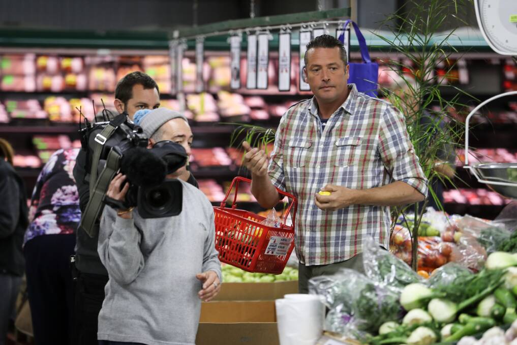 IN STORE: Alive and Cooking chef James Reeson selects fresh produce to put together three dishes in store for filming at Arnold's Fruit Market in Wodonga.