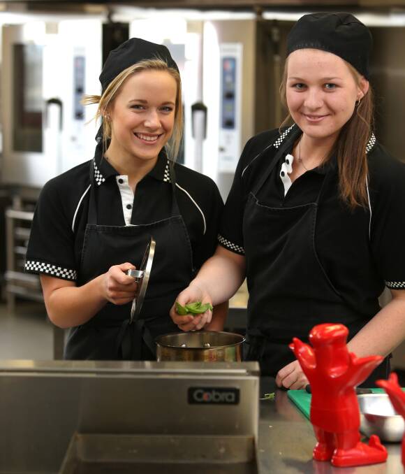 MASTER CHEFS: Wodonga Catholic College hospitality students Olivia Scholz, 17, and Molly Pryse, 18, will contest the Murray River Culinary Challenge regional final at Wodonga TAFE in August. Picture: ELENOR TEDENBORG