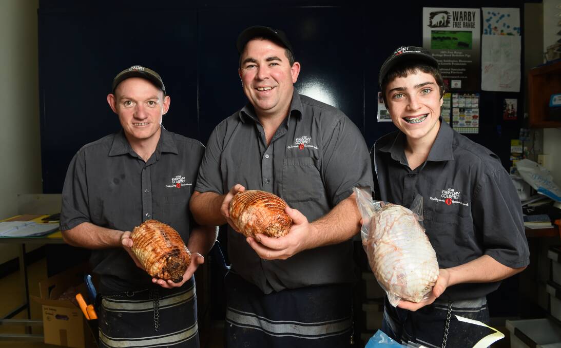 PLUCK A DUCK: Your Everyday Gourmet's Paul Niklaus, owner Dan Wallace and Daniel Hines have seen turkey sales soar this year. Customers want to cook turkey and speciality products like turducken. Picture: MARK JESSER