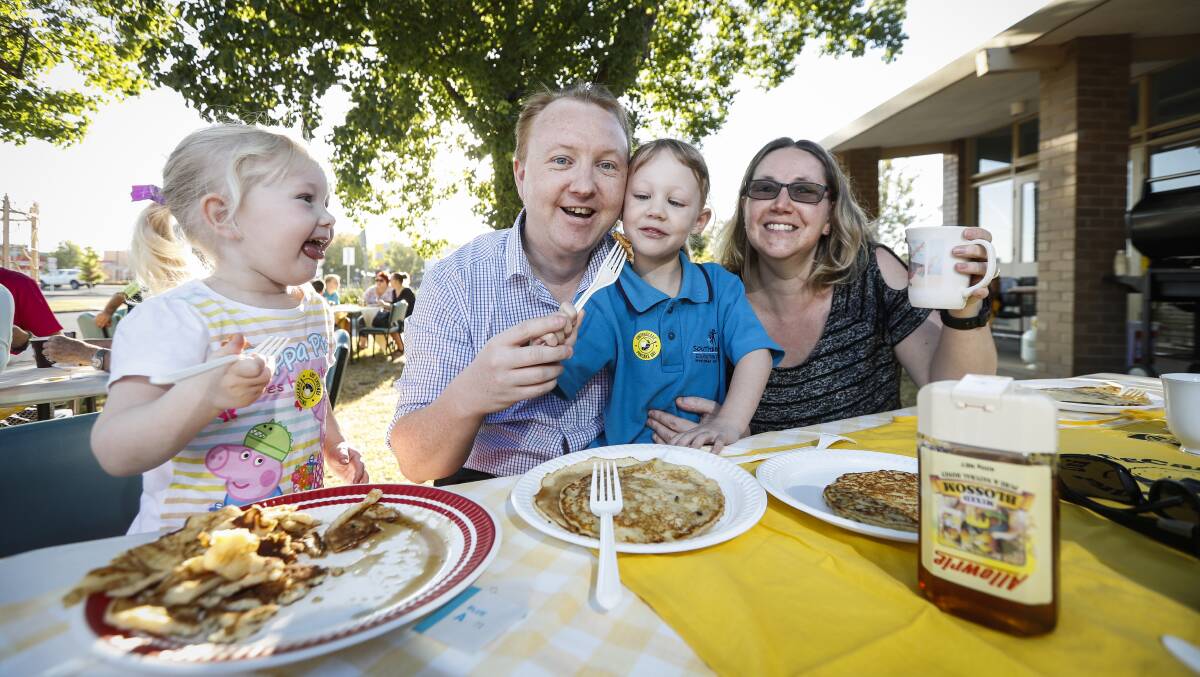 FAMILY AFFAIR: Wodonga's Scott and Vanessa Felstead and their daughters, Imogen, 3, and Madeline, 4, enjoy the Pancake Breakfast at St Stephen's Uniting Church.