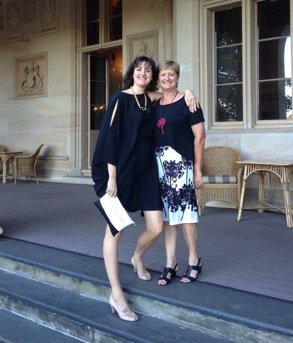 TOAST OF THE TOWN: Tumbarumba winery operator Cathy Gairn, right, and her daughter Kirsten Prins, celebrate Courabyra Wines' award-winning sparkling wine during a NSW Wine function at Government House in Sydney. 