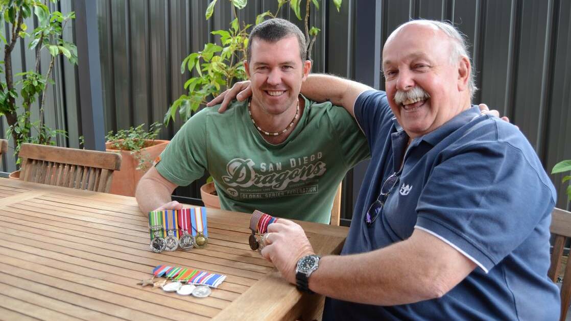 Dubbo man Jeff Caldbeck and his son Brendan will march together on Anzac Day. They are pictured with each other own medals, as well as Jeff's father's who served in WWII. Photo: ELOUISE HAWKEY
