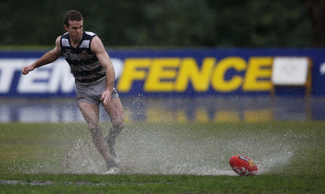 WATER skiing at the footy: Yarrawonga's Xavier Leslie played on a sodden Norm Minns Oval at Wangaratta on Saturday. The North East and Border was awash with the best rainfall for winter. Picture: MARK JESSER