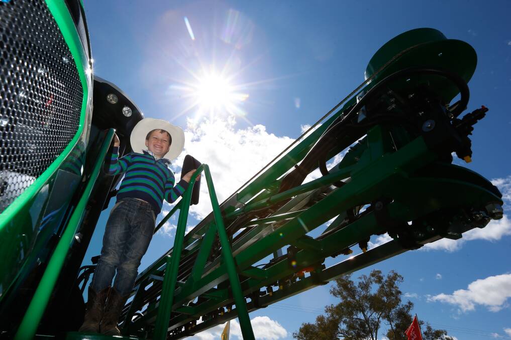 COUNTRY KID: Isaac Bennetts, 8 of Holbrook pictured on a self propelled sprayer on day two of the Henty field days. Picture: MARK JESSER 