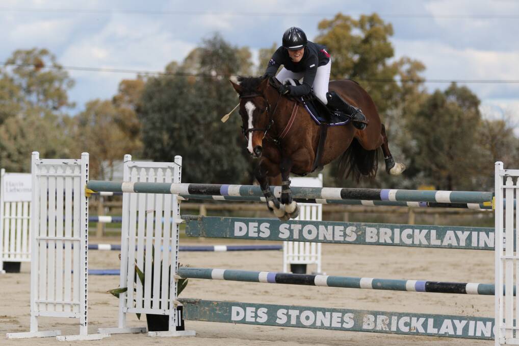 UP AND OVER: Border and Districts Showjumping Club Spring Grand Prix winner Jasmine Dennison and on her 'pocket rocket' Bubble and Squeak at the Albury Wodonga Equestrian Centre. Picture: Geoff McLean
