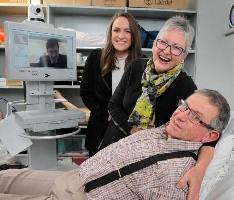 Cobram farmer Phillip Dick with his daughter Laura and wife Alison after recovering from a stroke thanks to telemedicine. Picture: DAVID THORPE