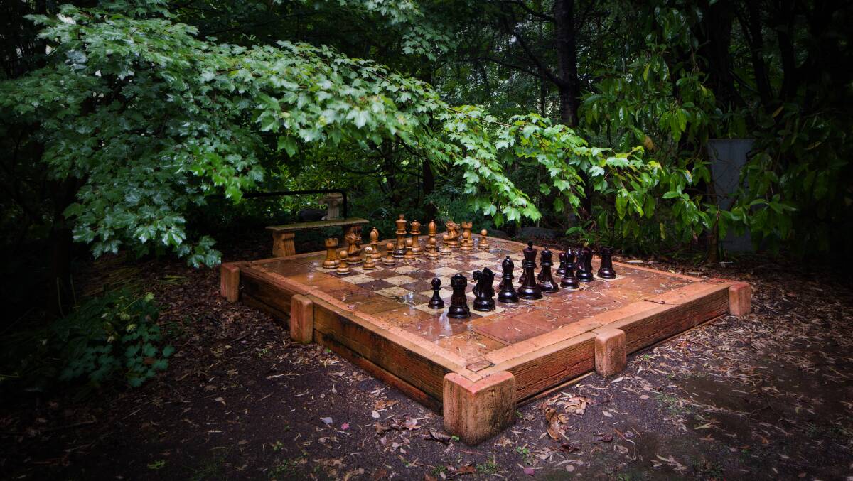 Just one of the garden 'follies' at a property for sale near Mt Beauty is the outdoor chess set which comes complete with teak chess pieces. Described as a gardener's delight Lothlorien will be sold at auction on April 8 and is open for inspection today at 3pm.