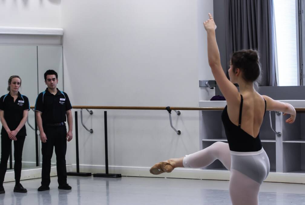 STUDYING THE CLASSICS: La Trobe University physiotherapy students Madeleine Hook and Brad Smith observe artist Benedicte Bemet of The Australian Ballet.
