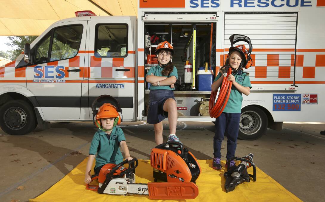 MINI VOLUNTEERS: Lily Boyer, 7, Jack Matheson, 5, and  Tully Dwyer,10, ready for the SES at Whorouly Primary School. Picture: ELENOR TEDENBORG