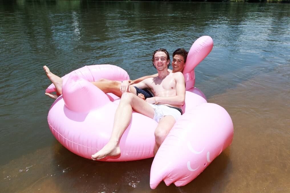BEAT THE HEAT: Albury's Campbell Chesser and Liam Dowling in the water at Noreuil Park.