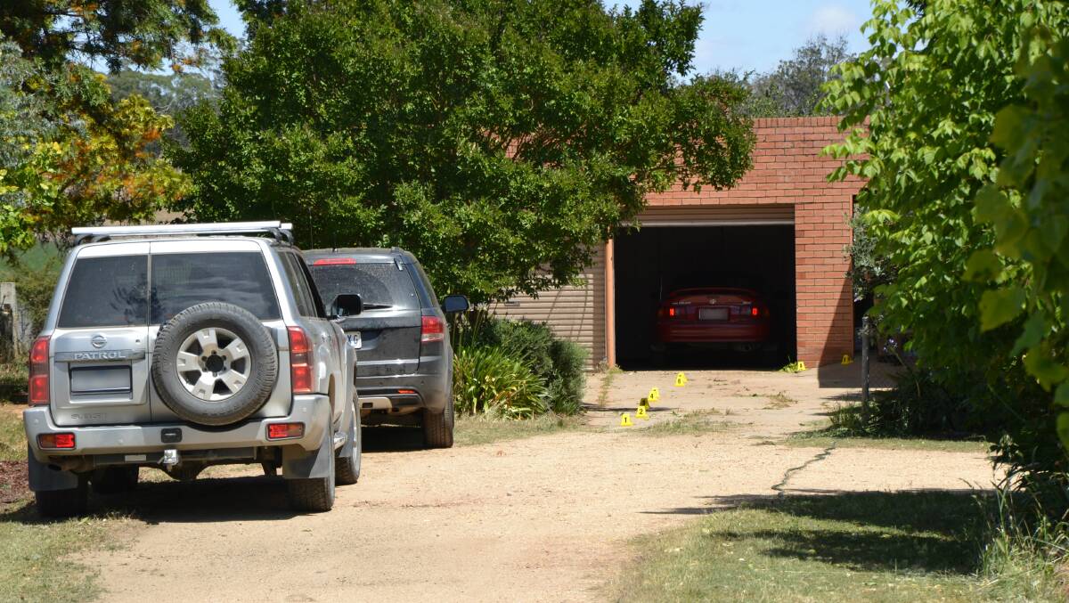 CRIME SCENE: Police at the Peechelba home where the stabbing occurred. 