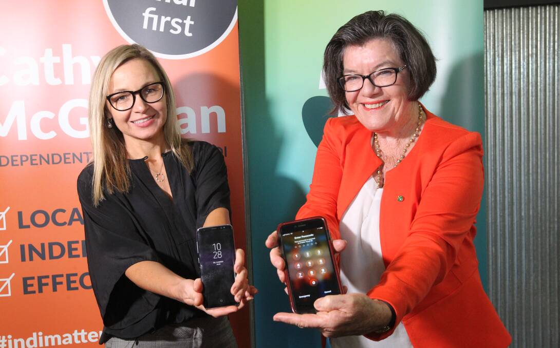 THEY WORK!: Telstra area general manager Loretta Willaton and Indi MP Cathy McGowan celebrate improved mobile coverage in the Kiewa Valley. Picture: SHANA MORGAN
