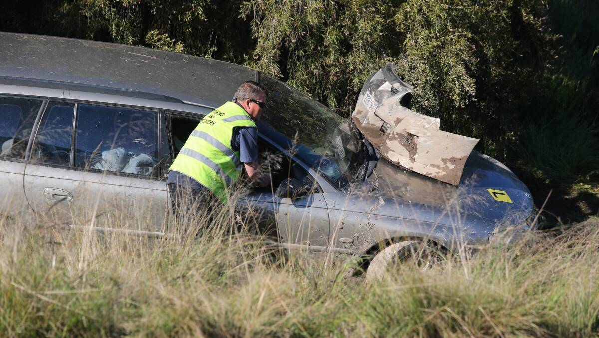 CRASH SCENE: The car which crashed into a cow on the freeway. Picture: MARK JESSER