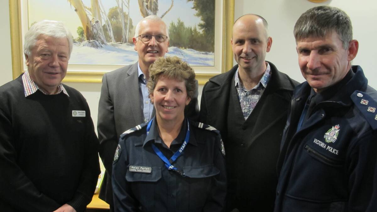 LOOK OUT SHOPLIFTERS: Wangaratta Rotary Club members Mike O’Shea and Clerk Fletcher, Leading Senior Constable Helen Parfett, Cafe Derailleur owner Eric Bittner and Inspector David Ryan at this week's crime prevention workshop.