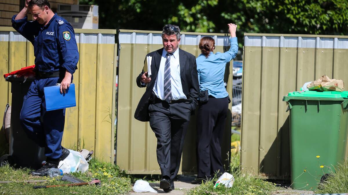 CRIME SCENE: Forensics officers and detectives spent the morning examining the property where a fatal stabbing occurred. Pictures: JAMES WILTSHIRE