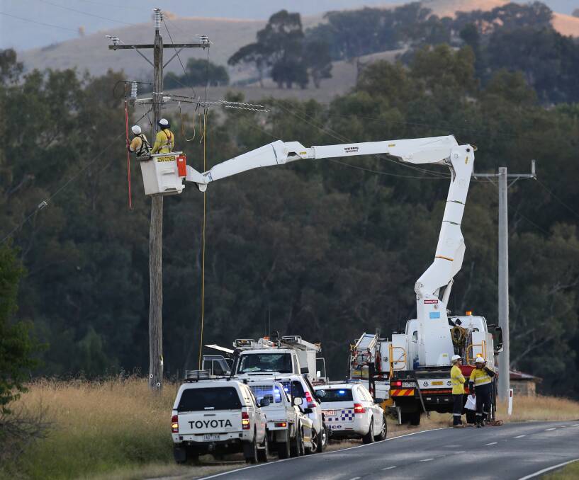 INVESTIGATION: Fallen power lines on the Kiewa Valley Highway formed part of the Worksafe and police investigation into the death of a truck driver on Tuesday. 