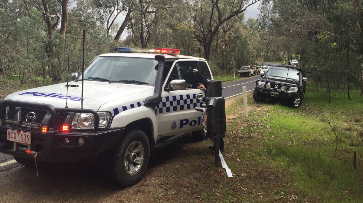 SEARCH PARTY: Police on the scene at the Wooragee property where Ben Dean went missing. Picture: BLAIR THOMSON
