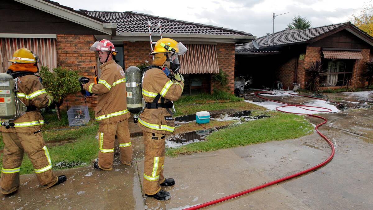 READY FOR REPLACEMENT: Firefighters regularly use breathing apparatus to tackle house and building fires.