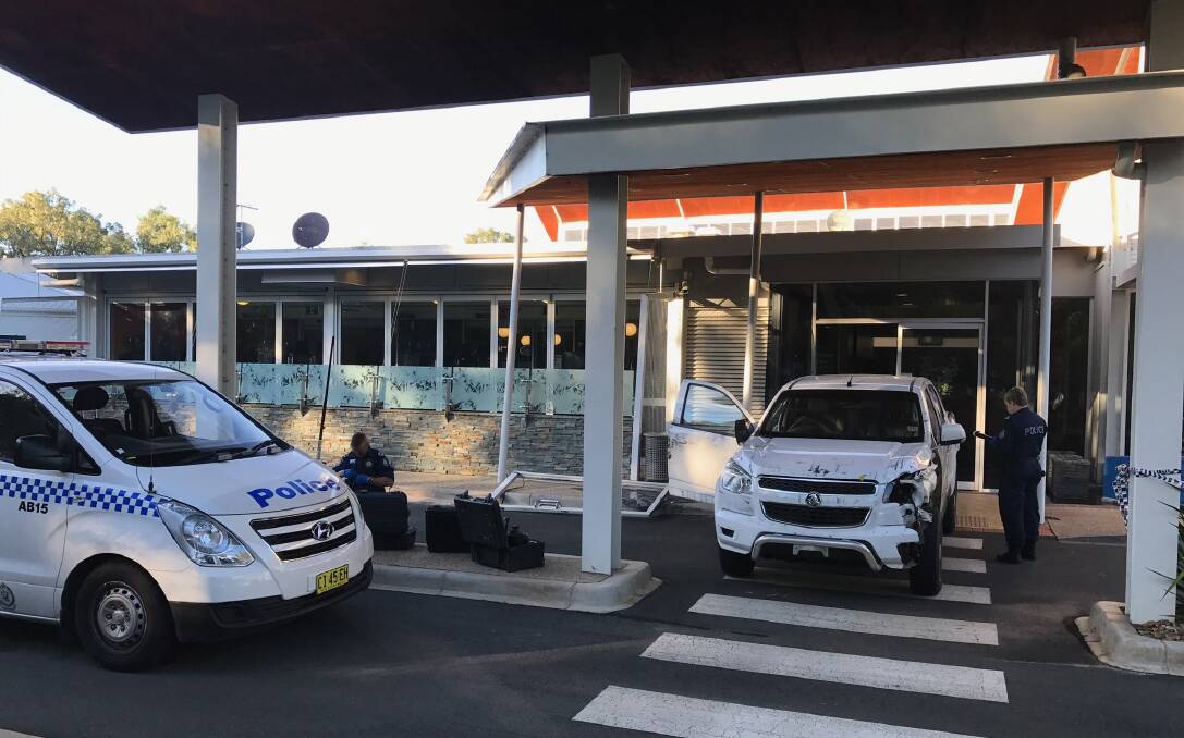 RAM RAID: The clean up on Friday morning after a ute backed through the golf club's front doors. Pictures: SHANA MORGAN