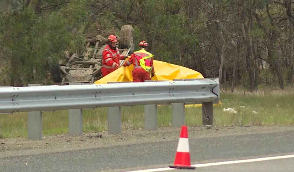 EMERGENCY SCENE: State Emergency Service volunteers were among those on the scene at a fatal crash off the Hume Freeway. Picture: 9 NEWS